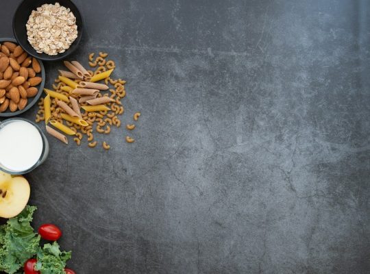 a black table topped with fruits and vegetables